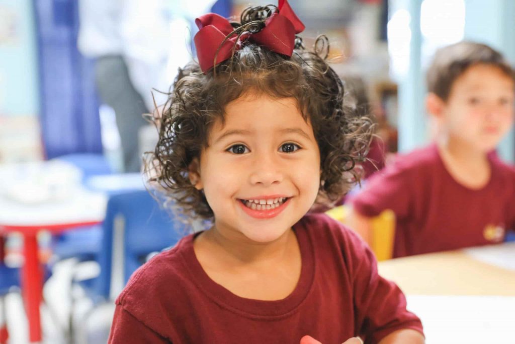 A toddler smiling.
